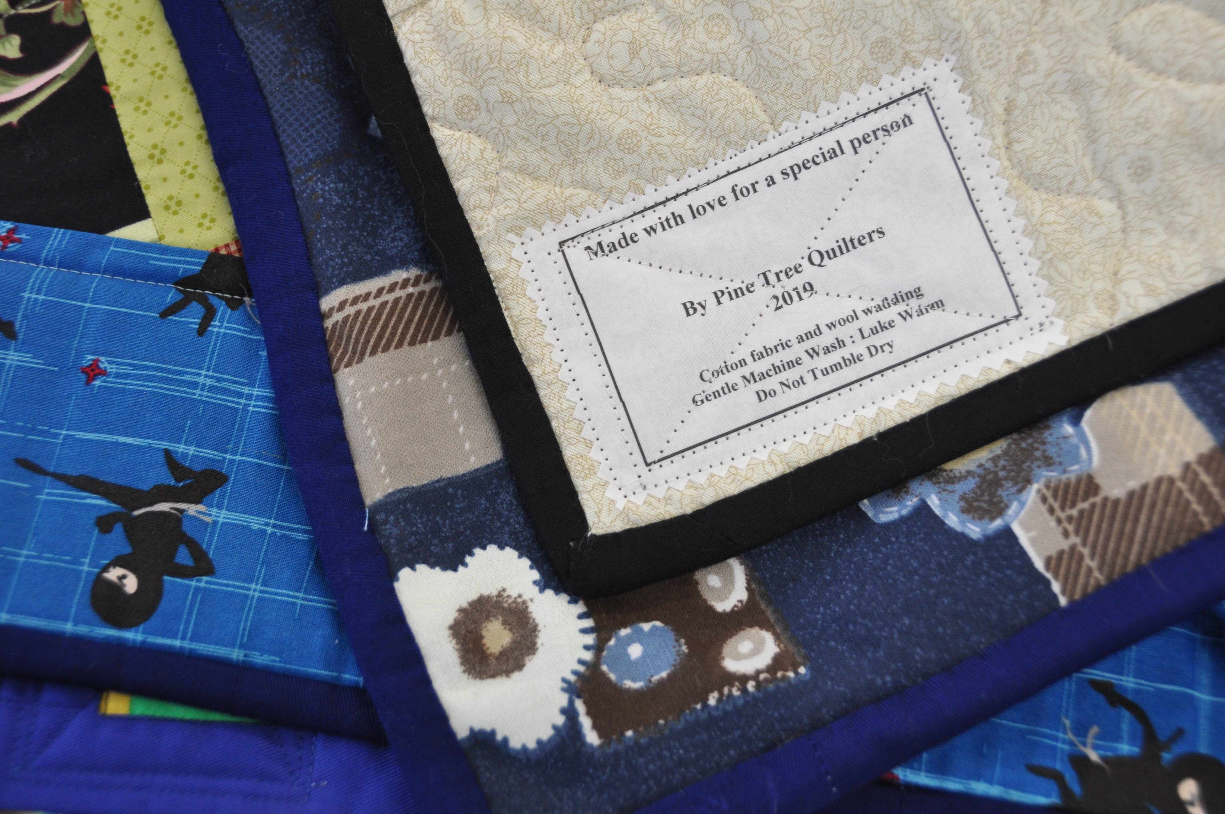 CHERISHED ITEM: Quilts donated by the Pine Tree Quilters feature personalised labels and stay with children regardless of whether they move between placements or remain in a long-term foster care arrangement.