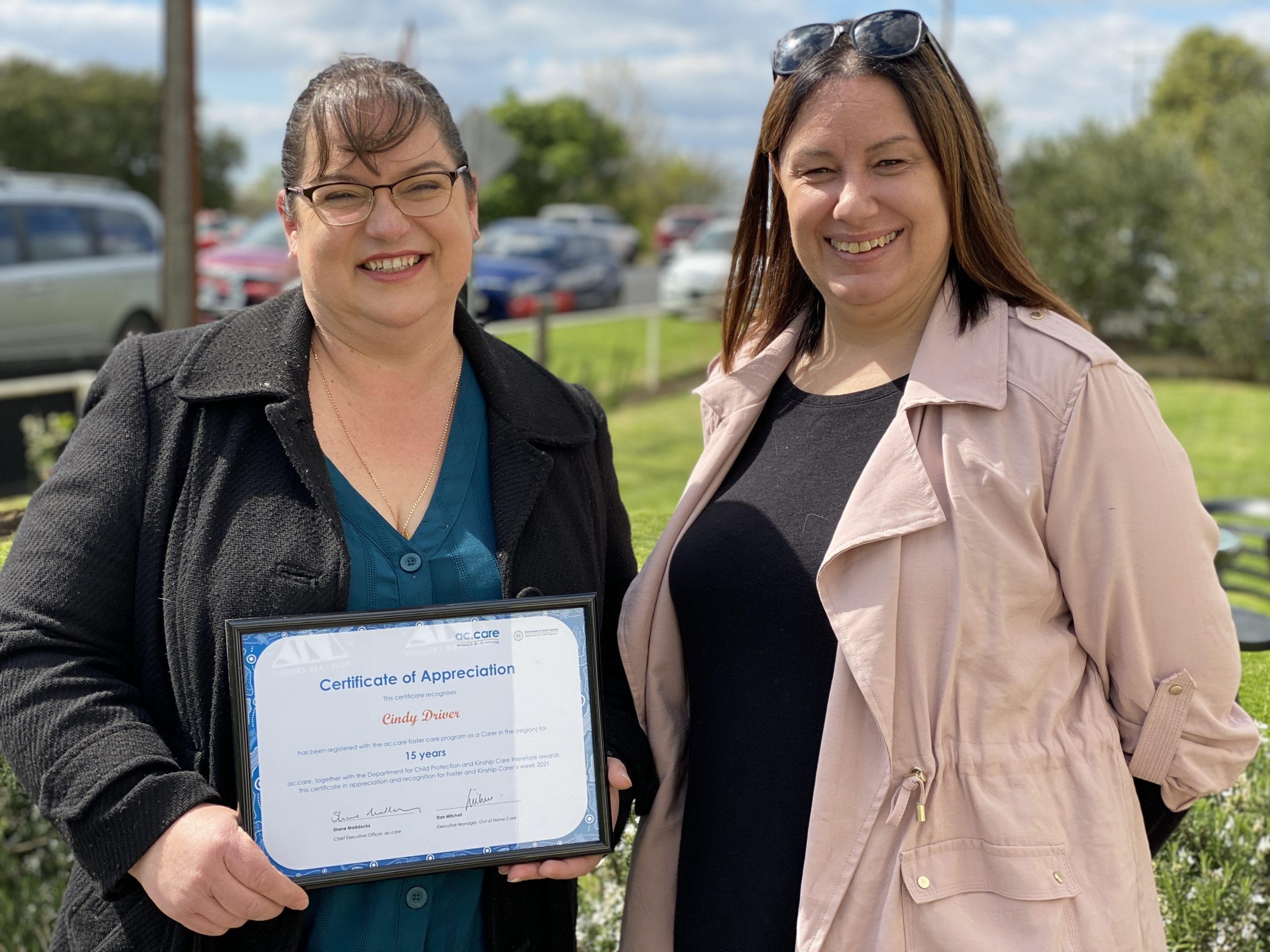 DEDICATION: Cindy Driver’s 15 years of dedication to foster care was recognised by ac.care Mount Gambier foster care manager Sherri Winter at an SA Foster and Kinship Carers Week function at the Limestone Coast Pantry on Thursday.