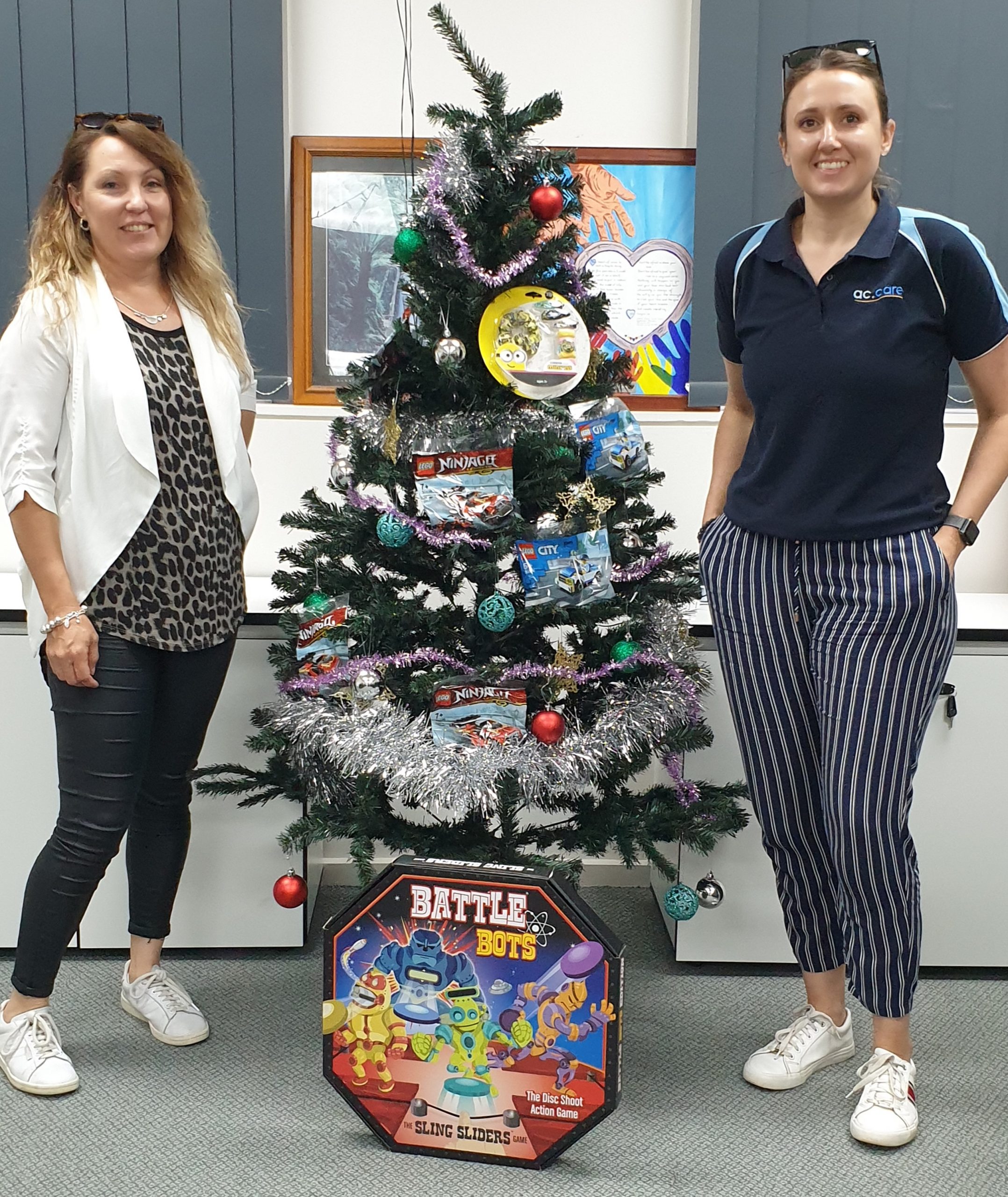 FESTIVE JOY: Riverland placement support workers Michelle and Melissa enjoyed distributing gifts provided via ac.care’s partnership with Good360 to foster carers to provide to children in their homes at Christmas. National charity Good360 diverts surplus goods from retailers to community organisations. 