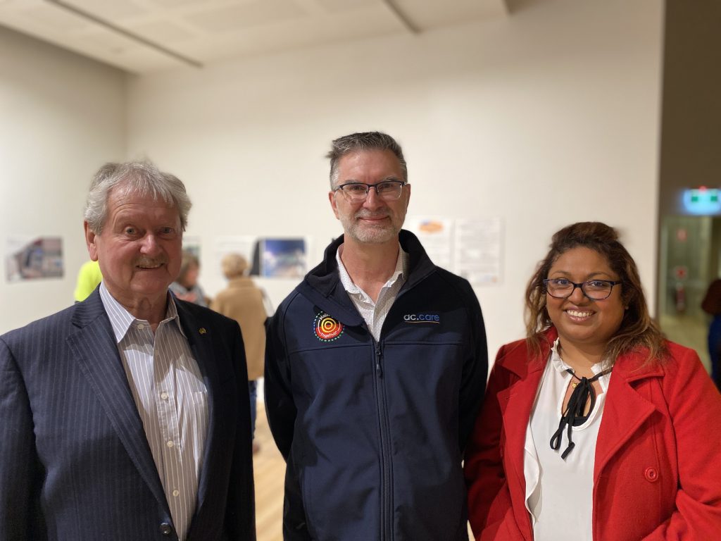 WORKING TOGETHER: Rural City of Murray Bridge Mayor Brenton Lewis, ac.care chief executive officer Shane Maddocks and ac.care Murraylands Homelessness Service manager Thanuja Hiripitiyage launch the Reflections on Homelessness – Our Future Can Still Be Bright exhibition.